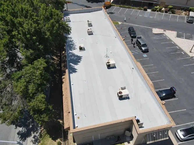 Sacramento commercial flat roof with white membrane and HVAC units