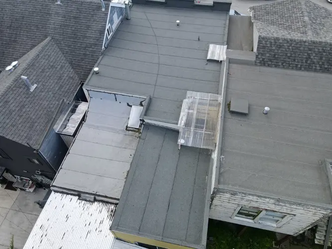 Flat commercial roofs with various materials and structures in Santa Cruz, serviced by Apollo Roofing Company contractors