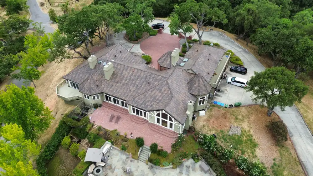 Overhead view of a large San Jose home showcasing Apollo Roofing’s professional tile roof work