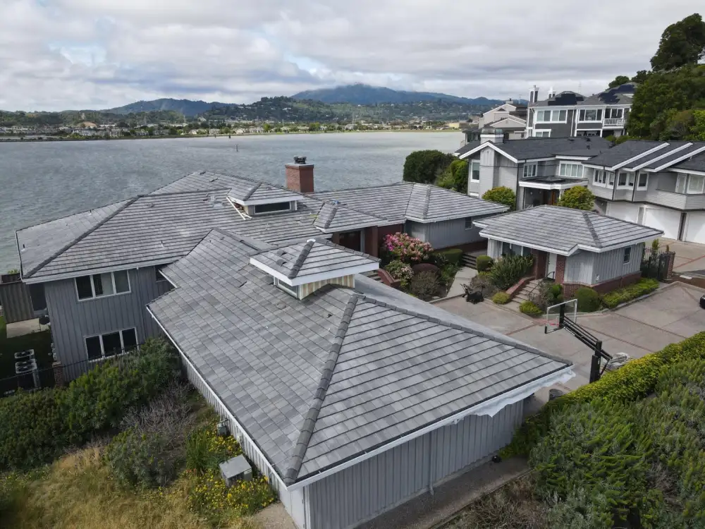 Tile roof replacement in progress on a coastal San Francisco house