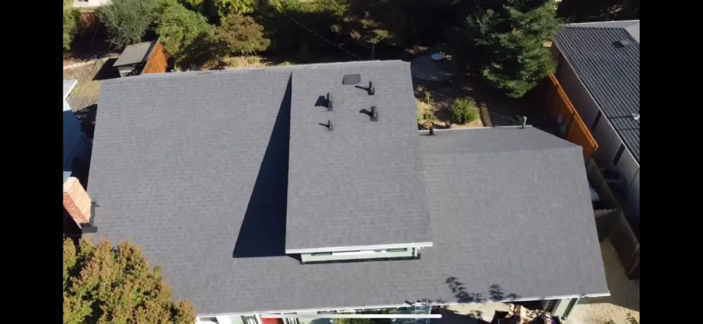 A house featuring updated shingles completed by a residential roofing contractor