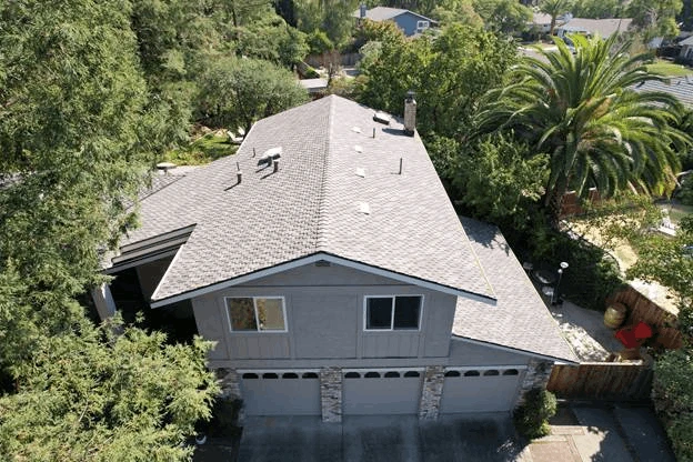 3 door garage white house trees