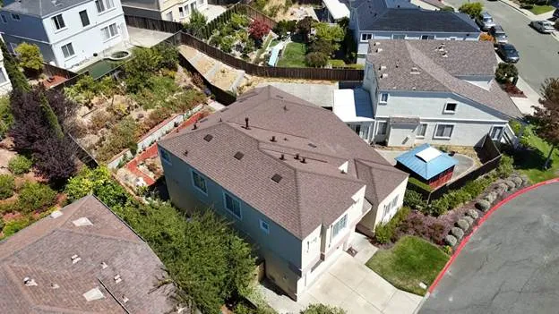 Brown roof sky blue house