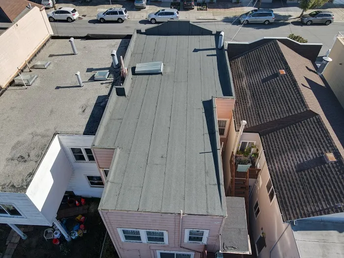 society pink house brown roof