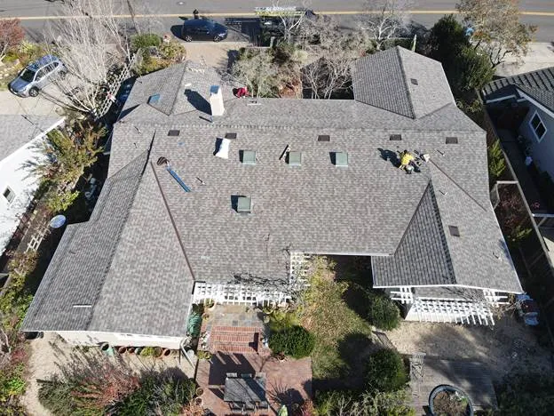 big gray roof people working